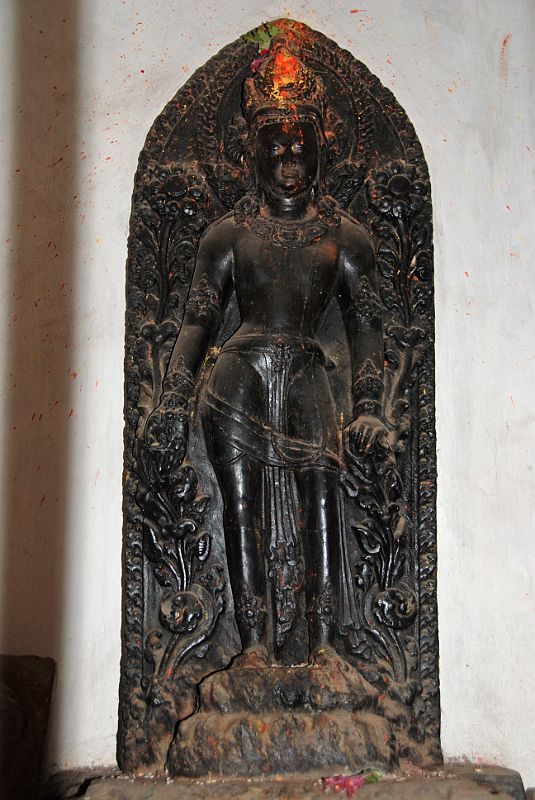 Kathmandu Patan 06 Mahabouddha Temple 03 Avalokiteshvara Sculpture A black statue of Avolokiteshvara rests inside the Mahabouddha Temple in Patan.